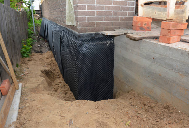 Happy homeowners after waterproofing job in Burke